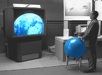 The T_Vision installation, with Earth displayed on a screen and its globe-shaped control